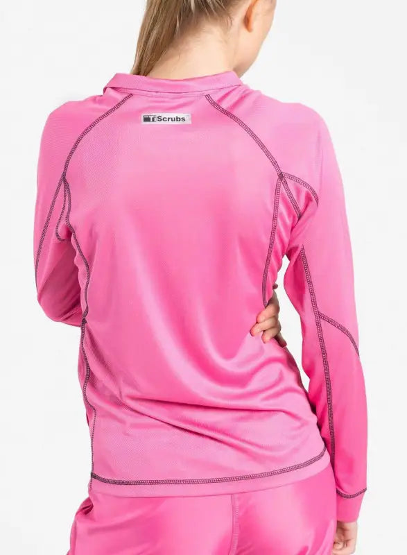 Pink long-sleeved women’s scrub jacket with contrast stitching for athletic style