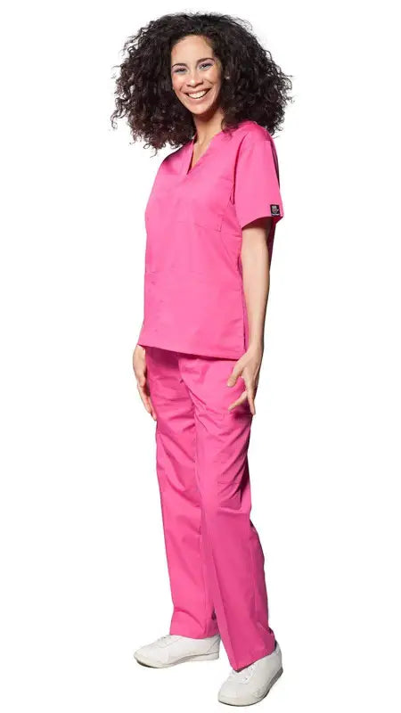 Pink Women’s Classic 8 Pocket Uniform Scrubs with pen slot and white shoes