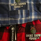 Plaid flannel shirts with Smoke Showin Apparel Co. logos, perfect for Burning Hop Flannel