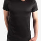 Plain black crew neck worn by model showcasing men’s short-sleeve underscrub