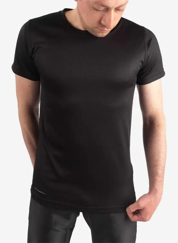 Plain black crew neck worn by model showcasing men’s short-sleeve underscrub