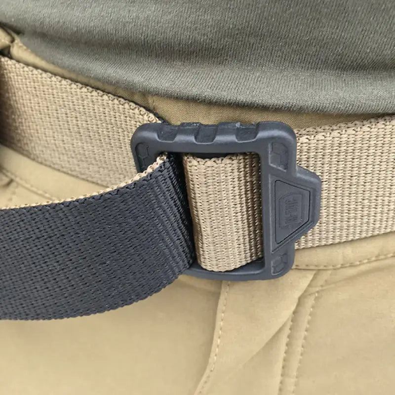 Plastic buckle securing a black strap to the M-Tac Double Duty Tactical Belt Hex