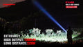 Powerful beam from E11-G2 1300 Lumen Rechargeable EDC Flashlight lighting up trees