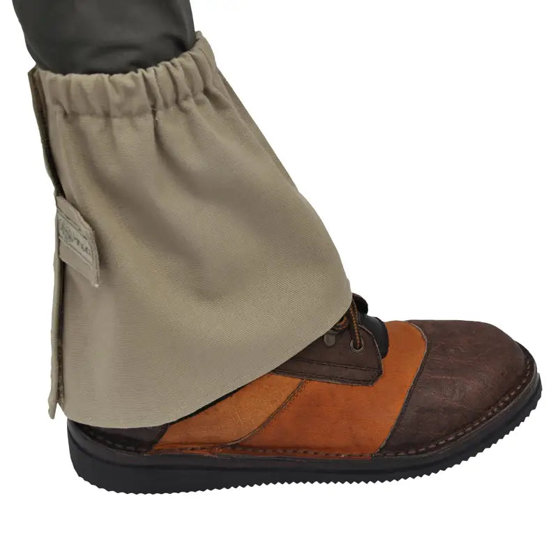 Protective fabric boot cover over brown leather shoe, showcasing Canvas Ankle Gaiters