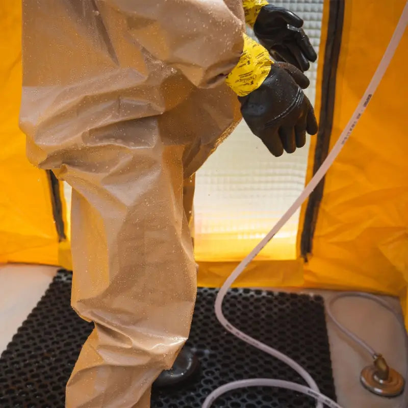 Protective hazmat suit with gloves for the Mira Safety DS-1 Portable Decontamination Shower