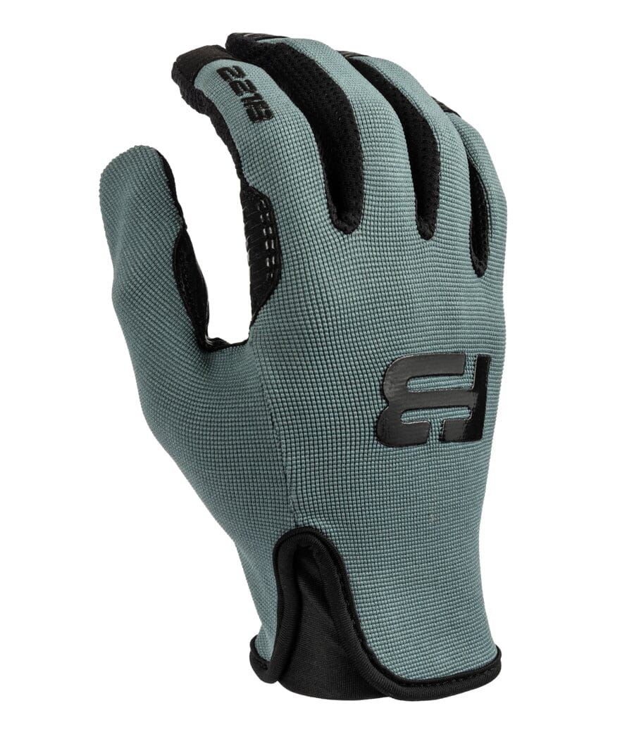 Lifestyle image of a person wearing Recon Tactical Gloves, highlighting their dexterity during outdoor tasks.