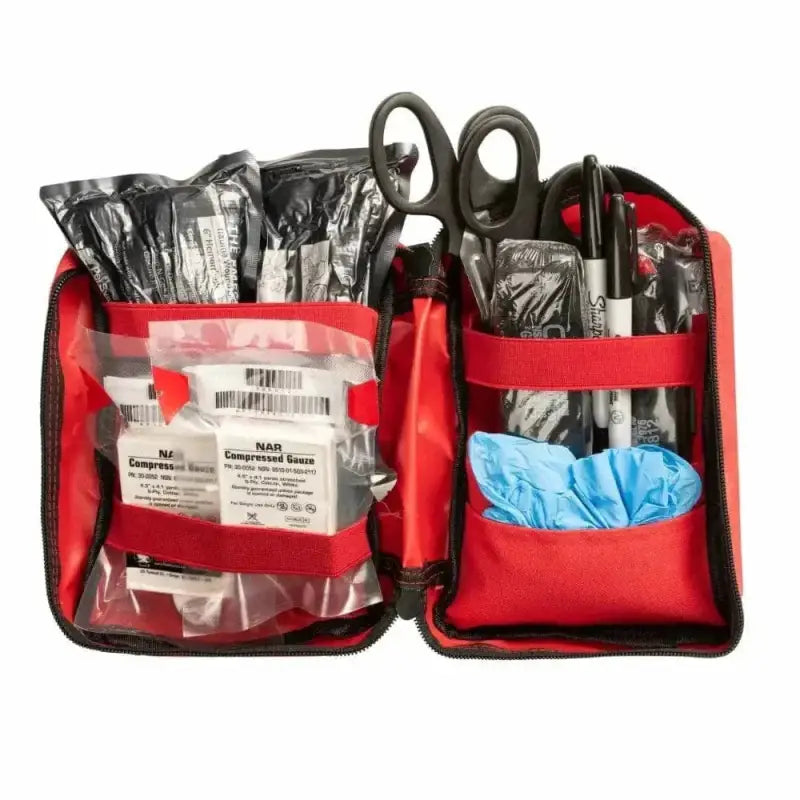 Red Scherber Public Access Bleeding Control Kit with medical supplies and blue gloves