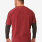 Red men’s long-sleeve underscrub with black long sleeves worn backwards