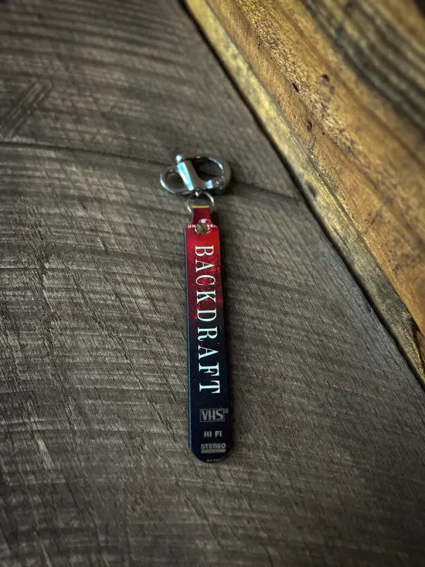 Red and black keychain with BACKTRACK text for Hi-Def SCBA Quick Release Designs