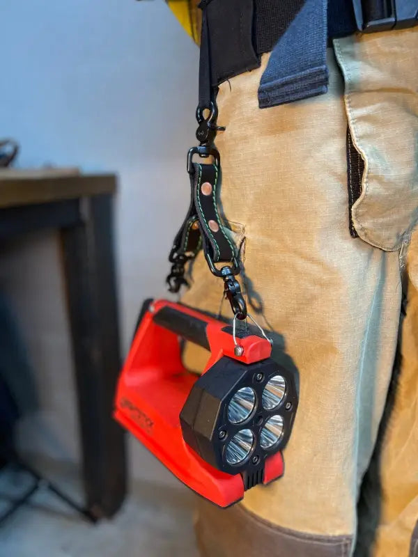 Red and black LED flashlight on a carabiner for Box Light Clip product