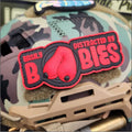 Red and black PVC patch featuring easily distracted text with fun size boobs design