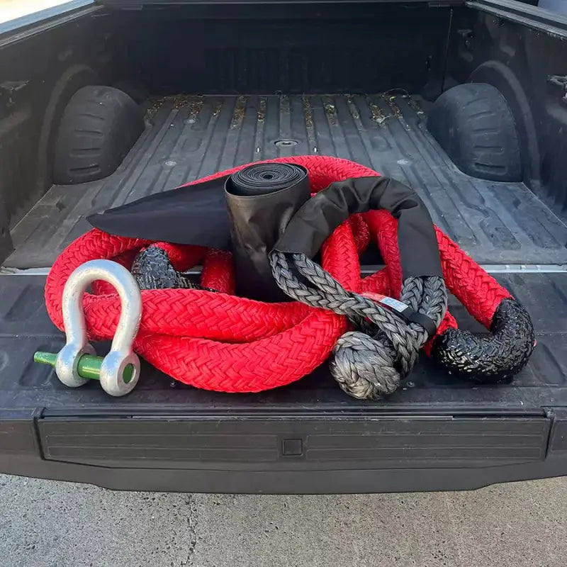 Red and black 30’ kinetic recovery ropes with a metal shackle for heavy equipment kit