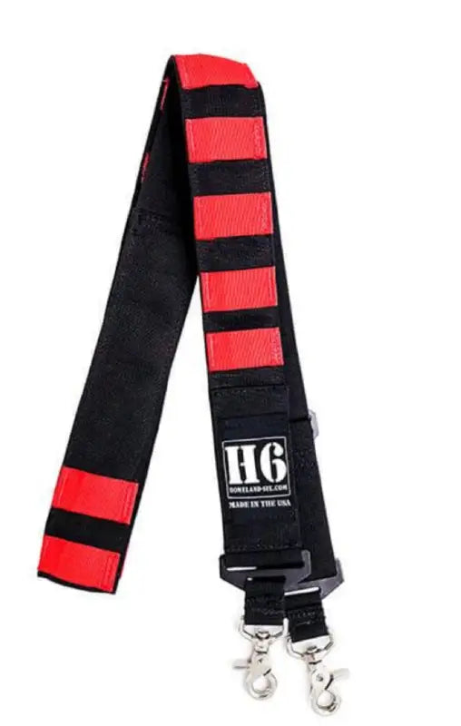 Red and black striped H6 Inferno Radio Strap with metal clips, durable military-grade ballistic nylon