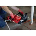 Red M18 FUEL™ concrete saw with water hose, bare tool, perfect for construction projects