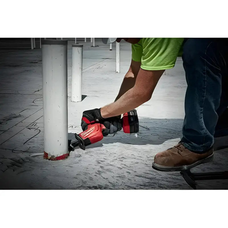 Red Milwaukee 2719-20 M18 FUEL Hackzall cutting a white post with Powerstate Brushless Motor