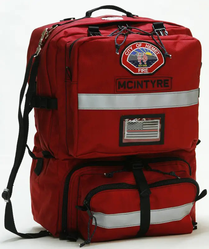 Red fire department backpack with two internal storage compartments in the Ruffian Out of County Bag Standard Size