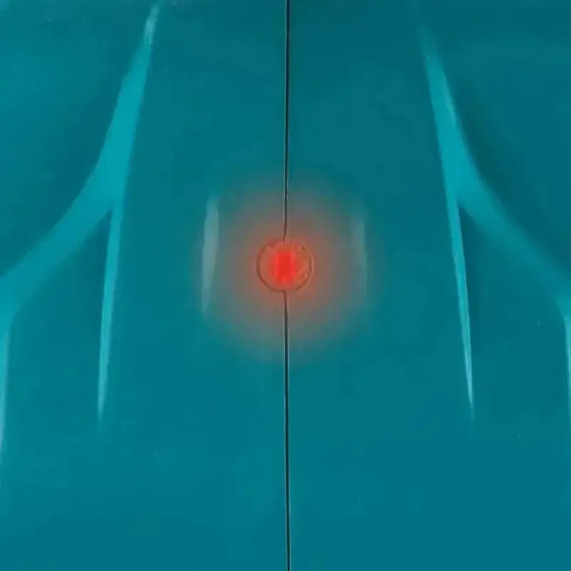 Glowing red dot with hazy ring illustrating Makita GEC01PL 80V XGT Brushless Power Cutter