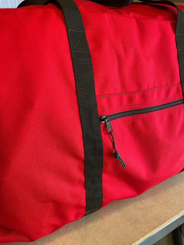 Red Academy Turnout Bag with black straps and zipper for turnout use