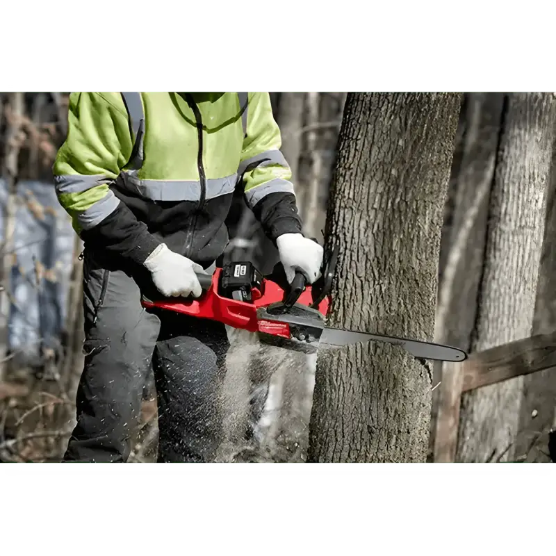 Red Milwaukee 2727-20C M18 FUEL™ 14’’ Chainsaw cutting through a tree trunk