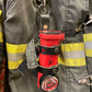 Red flashlight with black straps in THE MINIMALIST Leather Inverted Flashlight Holder