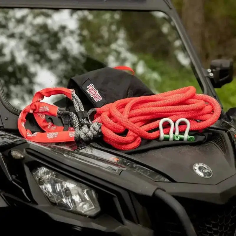 Red kinetic recovery rope with protective sleeve in SXS Off-Road Recovery Kit