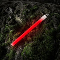 Red glowing M-Tac Glow Stick for vibrant illumination in any setting