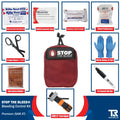 Red STOP THE BLEED bleeding control kit pouch with QuikClot Premium supplies around it