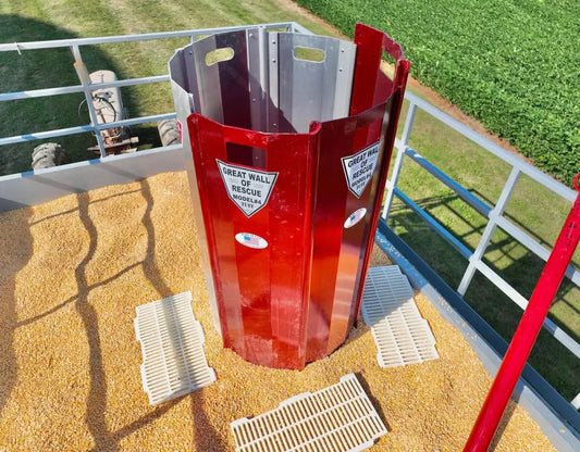 Red metal grain chute with safety labels for Grain Entrapment Rescue System-TuffKote