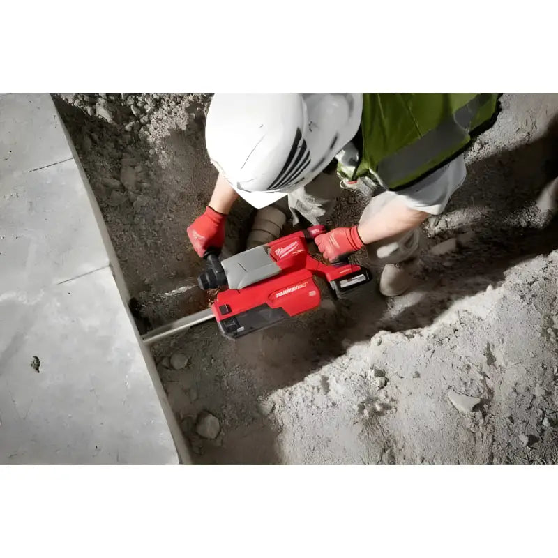 Red Milwaukee 2916-20 M18 FUEL 1-1/4 D-Handle Rotary Hammer in action on concrete