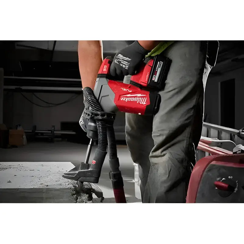 Red Milwaukee 2915-20 M18 FUEL 1-1/8’’ SDS Plus Rotary Hammer in action on a surface