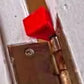 Red paper airplane on door hinge from Wedge Pack – Door & Sprinkler Combo Pack