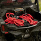 Red synthetic recovery rope coiled in SXS Off-Road Recovery Kit storage compartment