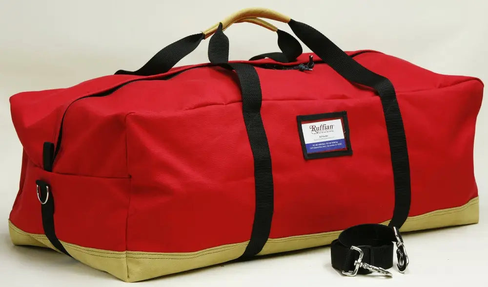 Red and tan turnout gear bag with center zipper for durable gear storage
