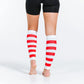 Red and white striped calf compression sleeves paired with black shorts for stylish support