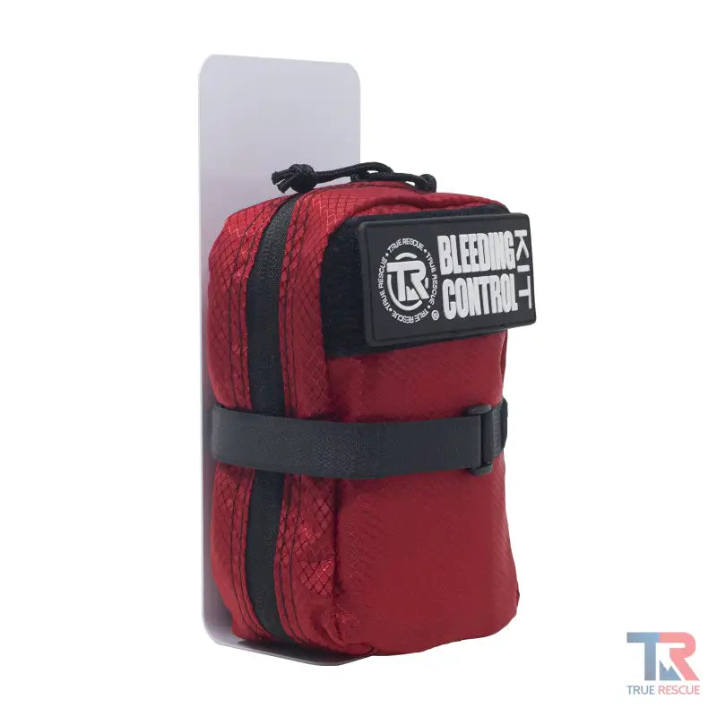 Red zippered pouch with black straps for Single Bleeding Control Kit Mounting Bracket