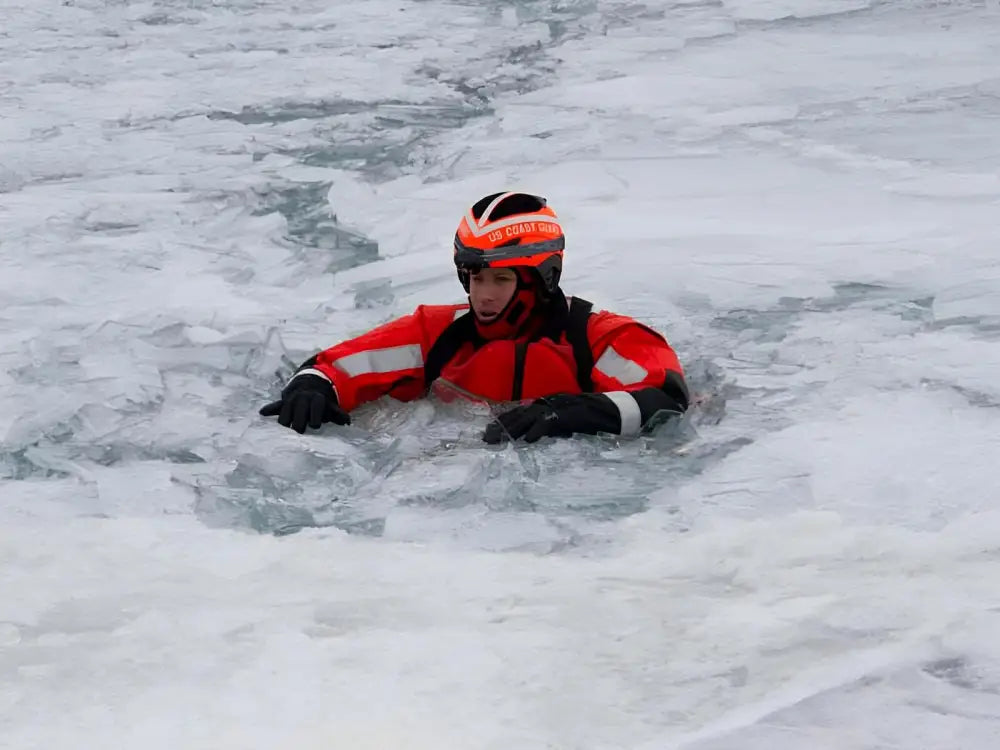 Rescue worker in red suit using ARM-LOC Rescue System for water rescues and victim pulls