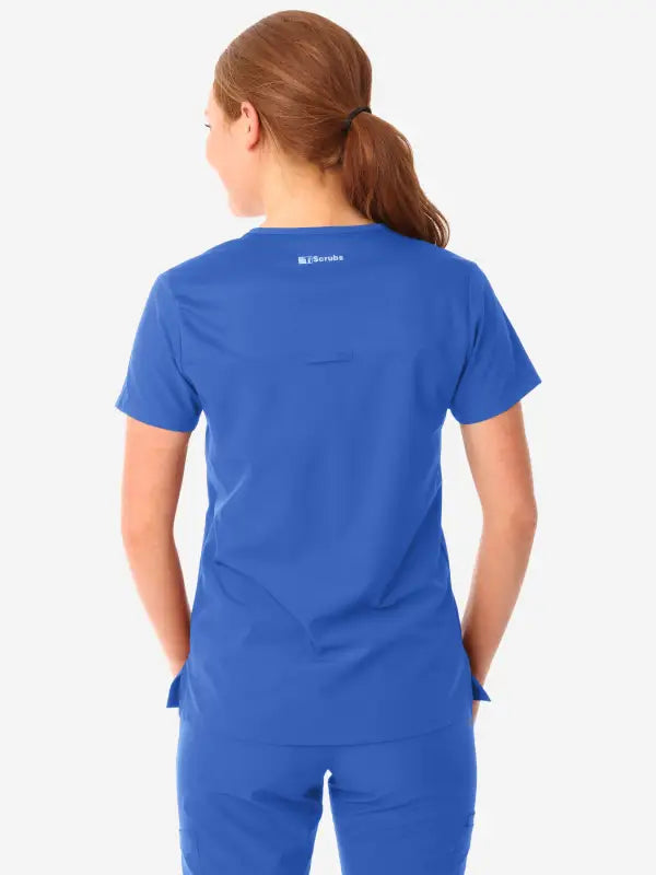 Royal blue women’s tuckable one-pocket scrub top displayed from the back