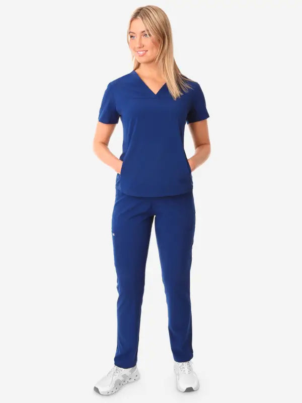 Royal blue women’s stash-pocket scrub uniform with v-neck top and matching pants