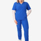 Royal blue women’s stash-pocket scrub top with white undershirt and sneakers