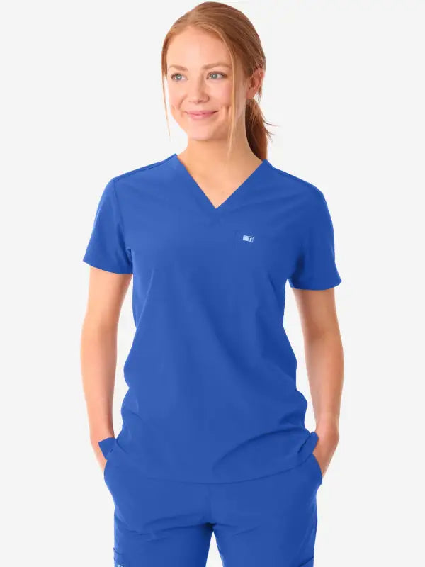 Royal blue women’s tuckable one-pocket scrub top with v-neck and short sleeves