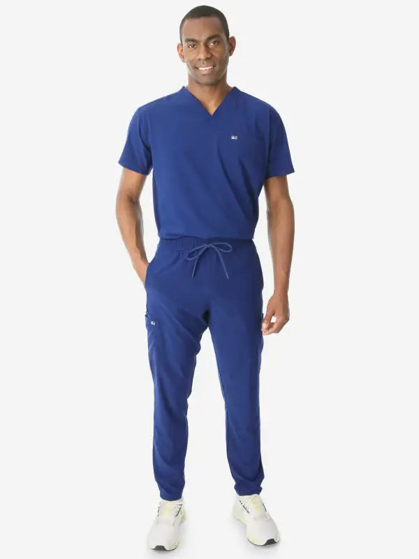 Royal blue men’s double-pocket scrub set featuring jogger pants and v-neck top