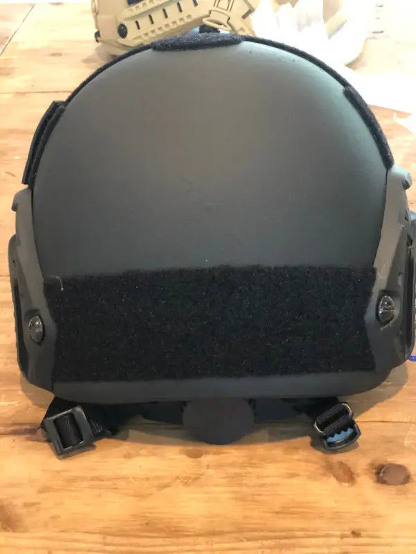 Black tactical helmet with adjustable straps for RT2 Ballistic High Cut protection