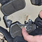 Broken black computer mouse pulled apart to highlight durability of RT2 Ballistic High Cut Helmet