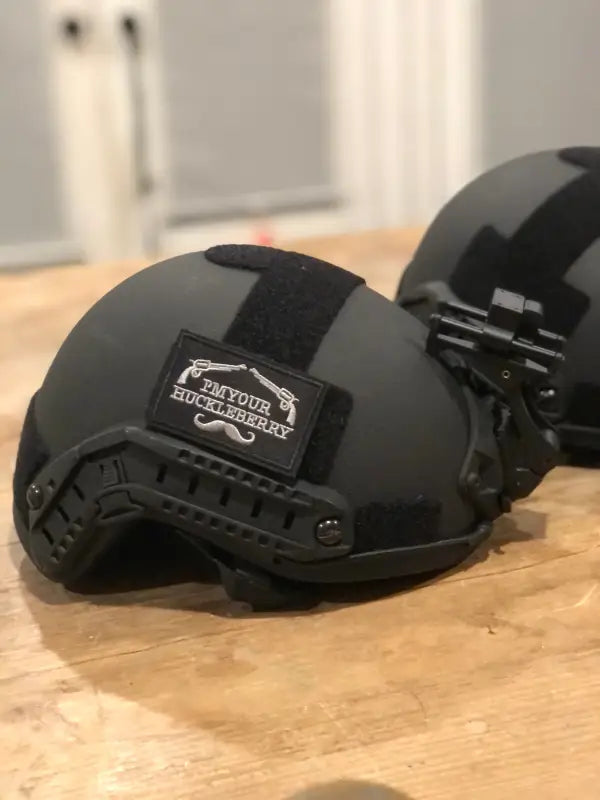 Black RT2 Ballistic High Cut Helmet with rail attachments and patch from Redemption Tactical