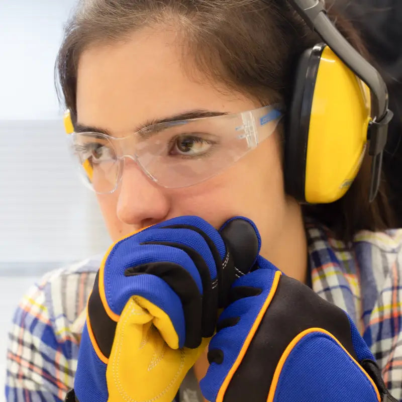 Safety-conscious worker wearing anti-fog clear safety glasses for high impact protection