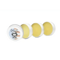 Three round tins of yellow beard wax with vintage-style labels in a sampler pack