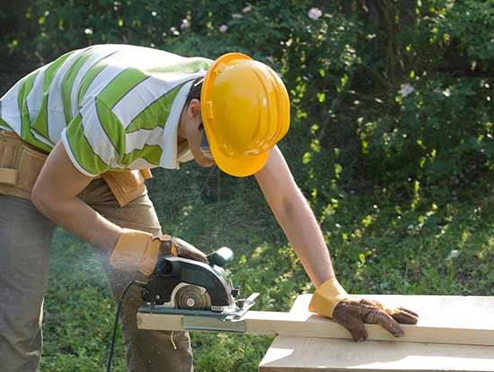 Carpenter using circular saw with Finger Cut Kit for safe finger cut protection