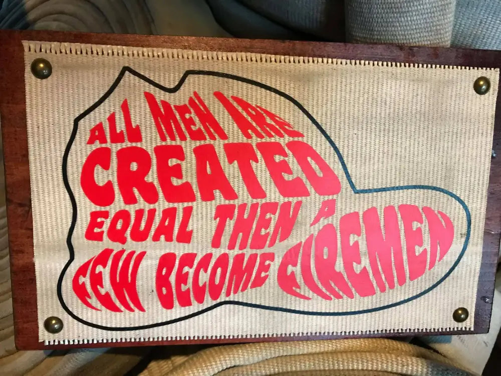 All Men Are Created Equal Fire Hose Sign with red and pink text design