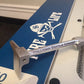 Ski featuring blue design and skull logo on Halligan Bottle Opener - Nickel Plated