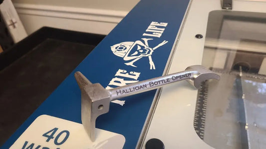 Ski featuring blue design and skull logo on Halligan Bottle Opener - Nickel Plated